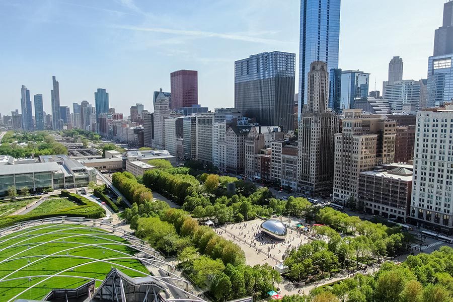 Chicago Insurance - Aerial View of Chicago Skyline, Green Parks, and the Cloud Gate Bean Sculpture on a Sunny Day